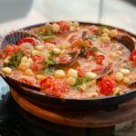 Arroz caldoso con ostiones y pescado confitado